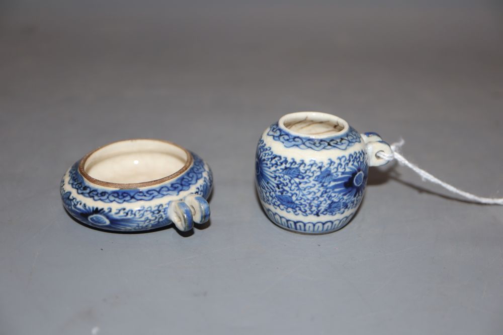 Two Chinese blue and white bird feeders, largest diameter 5cm